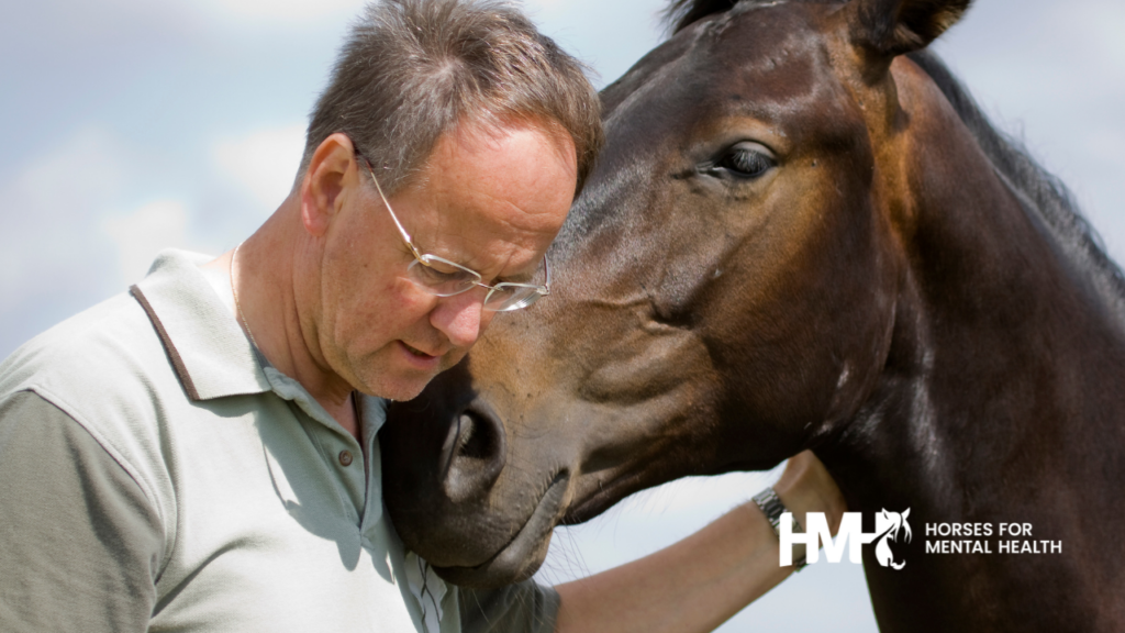 A man and horse touching