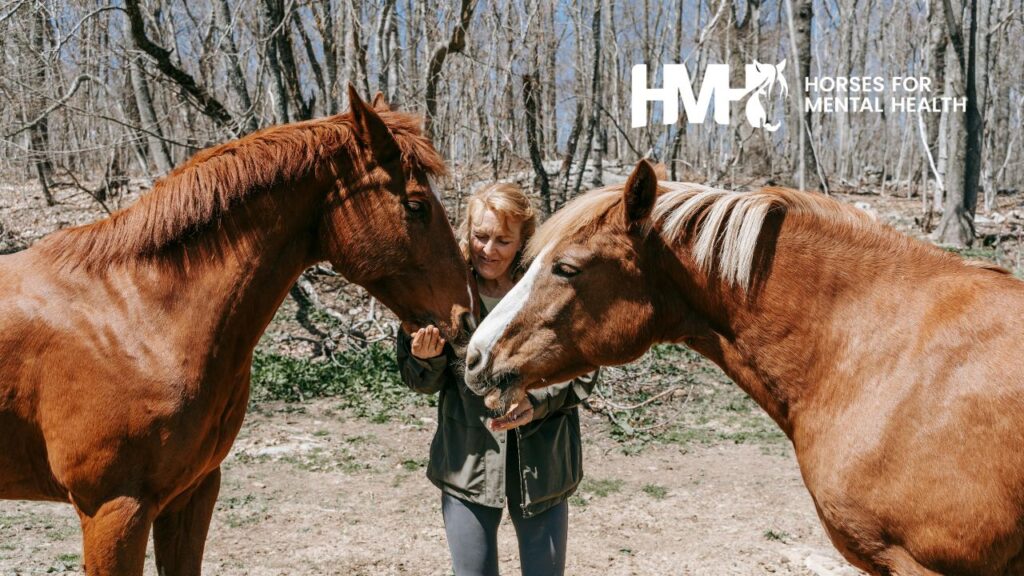 Woman with two horses